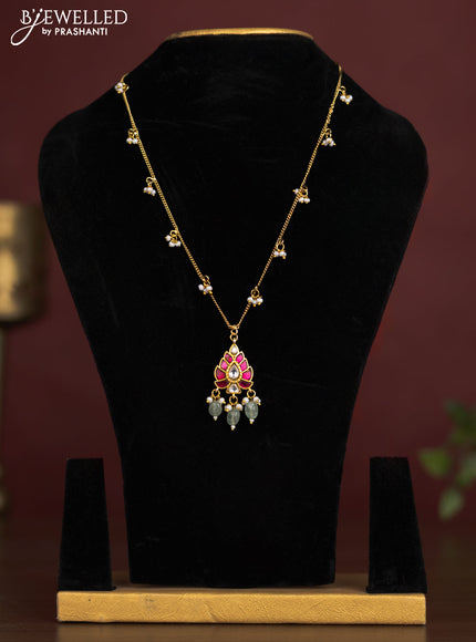 Antique chain with a leaf design pendant, jadau kundan stones, and pearl & bead hangings