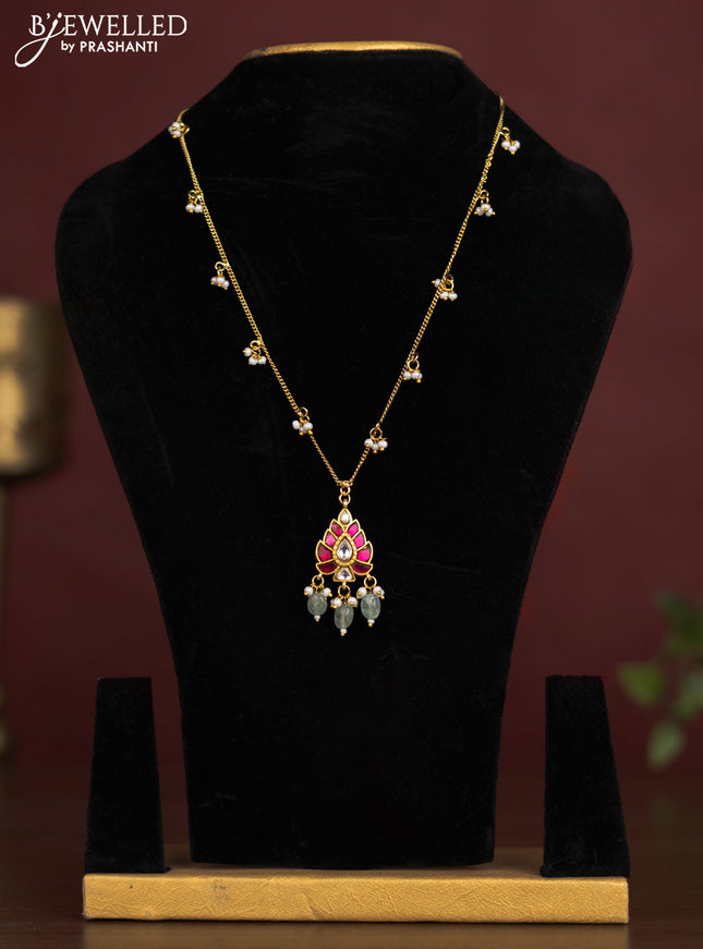 Antique chain with a leaf design pendant, jadau kundan stones, and pearl & bead hangings