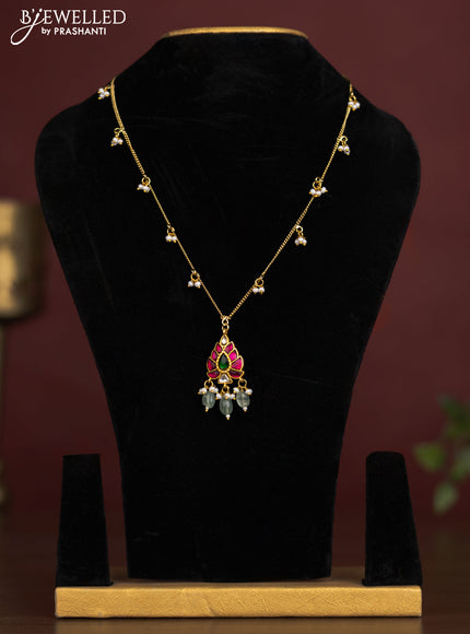 Antique chain with a leaf design pendant, jadau kundan stones, and pearl & bead hangings