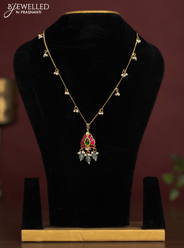 Antique chain with a leaf design pendant, jadau kundan stones, and pearl & bead hangings