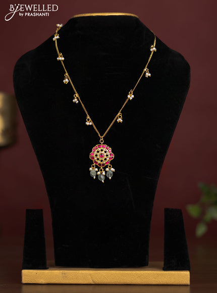 Antique chain with a floral pendant, jadau kundan stones, and pearl & bead hangings