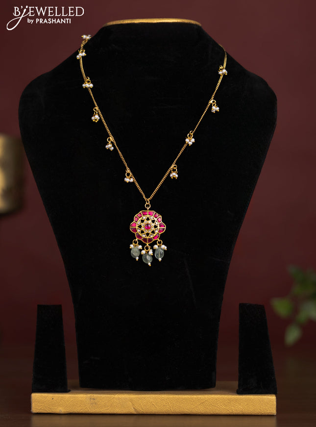 Antique chain with a floral pendant, jadau kundan stones, and pearl & bead hangings
