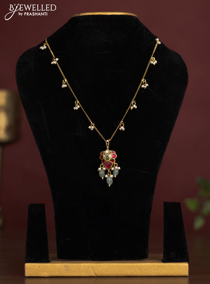 Antique chain with a leaf design pendant, jadau kundan stones, and pearl & bead hangings