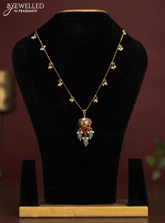 Antique chain with a leaf design pendant, jadau kundan stones, and pearl & bead hangings