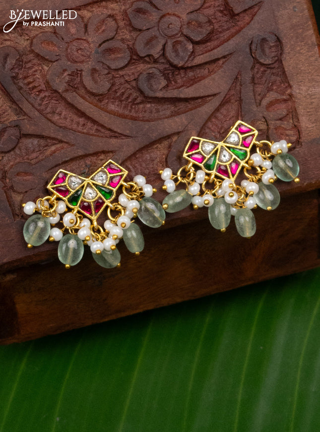 Jadau earrings with jadau kundan stones and pearl & mint green beads hanging