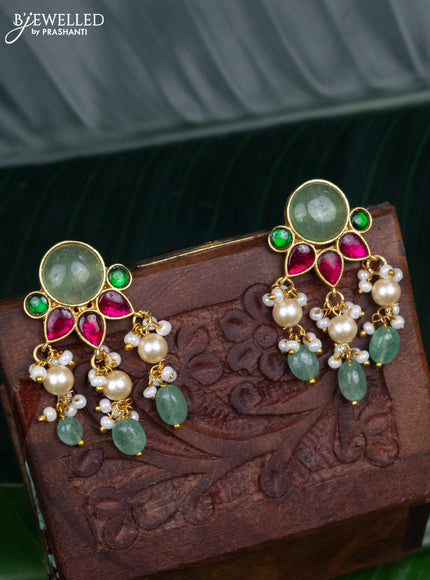 Jadau screw type earrings with jadau kundan stones and pearl & mint green beads hanging