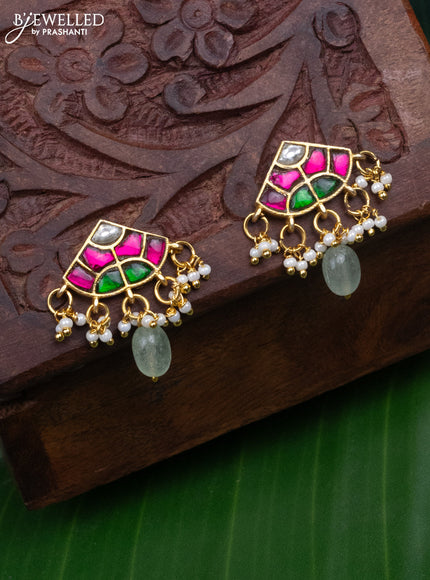 Jadau earrings with jadau kundan stones and pearl & mint green beads hanging