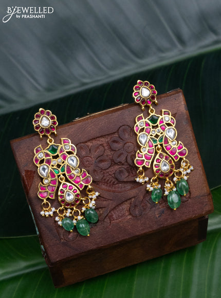 Jadau screw type earrings peacock design with jadau kundan stones and pearl & green beads hanging