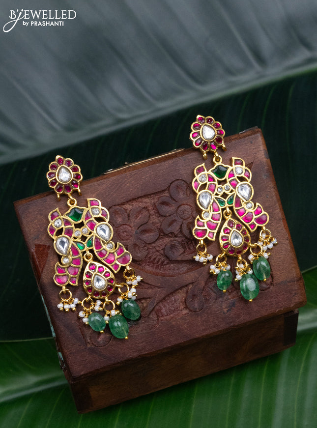 Jadau screw type earrings peacock design with jadau kundan stones and pearl & green beads hanging