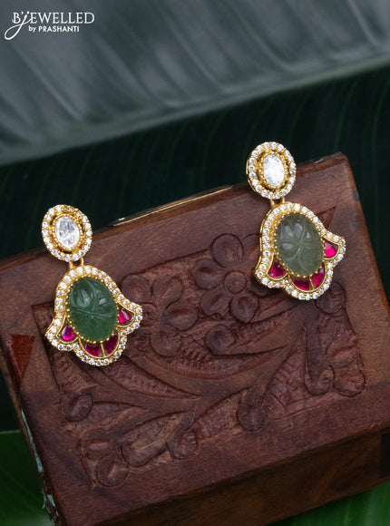 Jadau screw type earrings with jadau kundan and cz stones