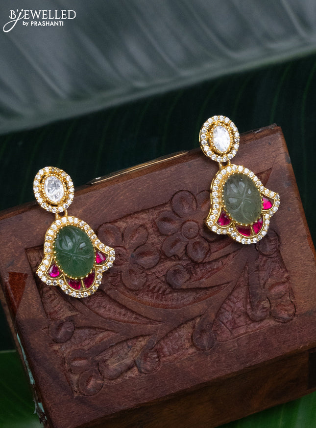 Jadau screw type earrings with jadau kundan and cz stones
