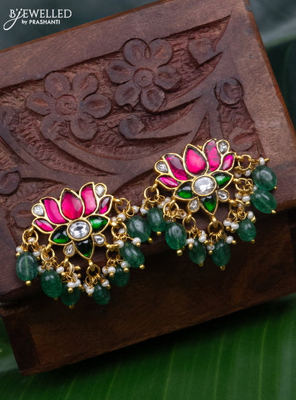 Jadau screw type earrings peacock design with jadau kundan stones and pearl & green beads hanging