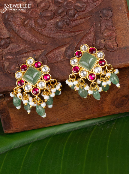 Jadau screw type earrings peacock design with jadau kundan stones and pearl & mint green beads hanging