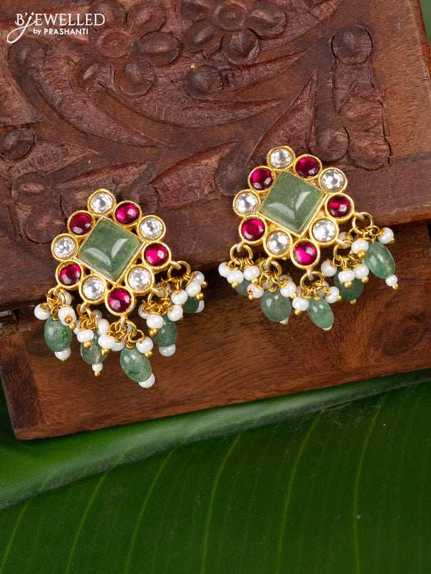 Jadau screw type earrings peacock design with jadau kundan stones and pearl & mint green beads hanging