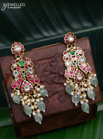 Jadau screw type earrings peacock design with jadau kundan stones and pearl & mint green beads hanging