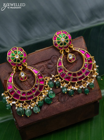 Jadau earrings with jadau kundan stones and pearl & green beads hanging