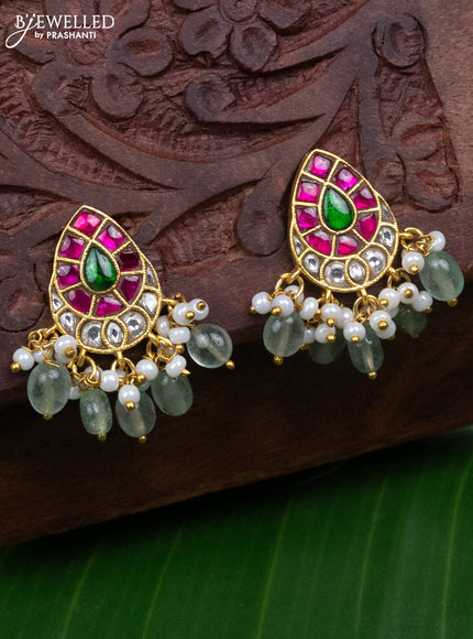 Jadau earrings with jadau kundan stones and pearl & mint green beads hanging