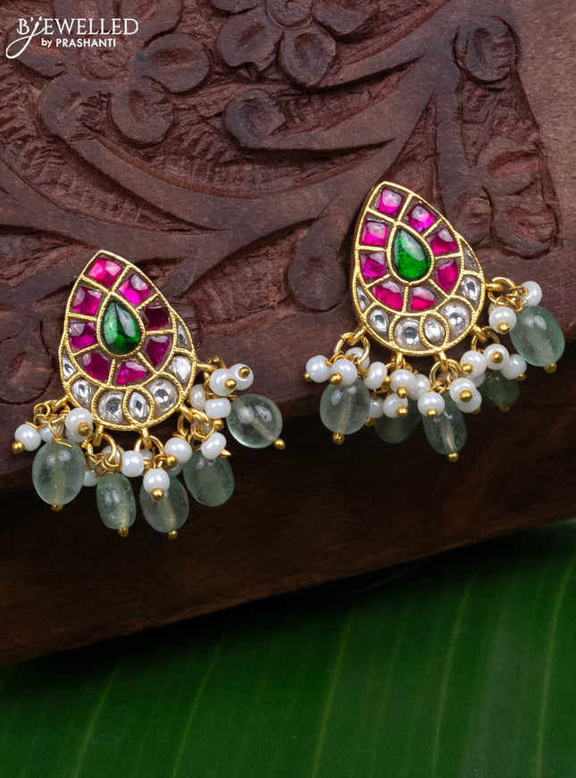 Jadau earrings with jadau kundan stones and pearl & mint green beads hanging