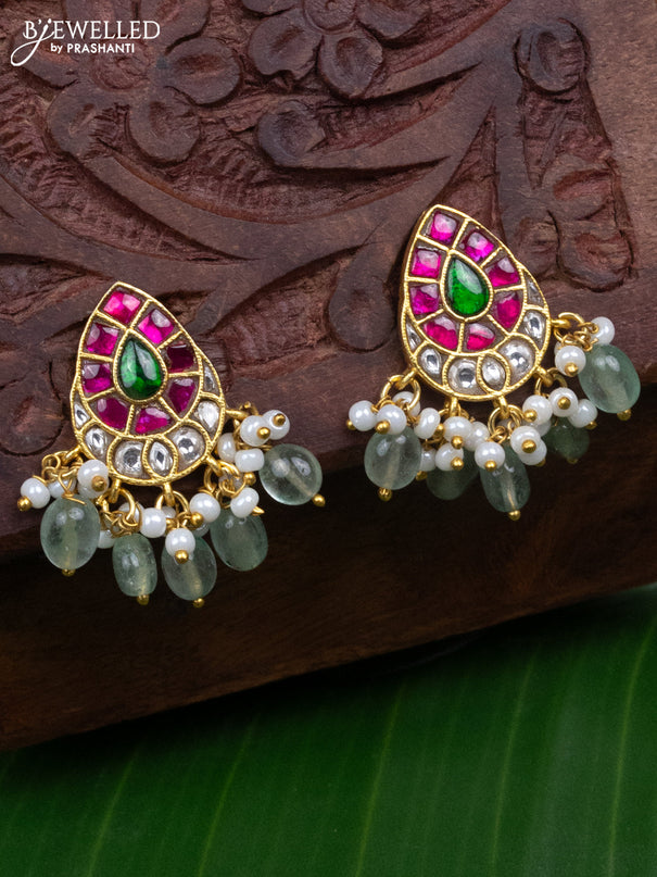 Jadau earrings with jadau kundan stones and pearl & mint green beads hanging