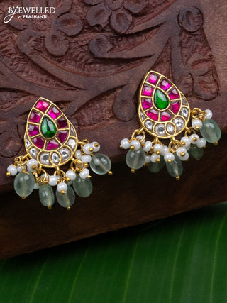 Jadau earrings with jadau kundan stones and pearl & mint green beads hanging