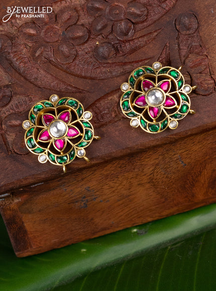 Jadau screw type earrings with floral design and jadau kundan stones