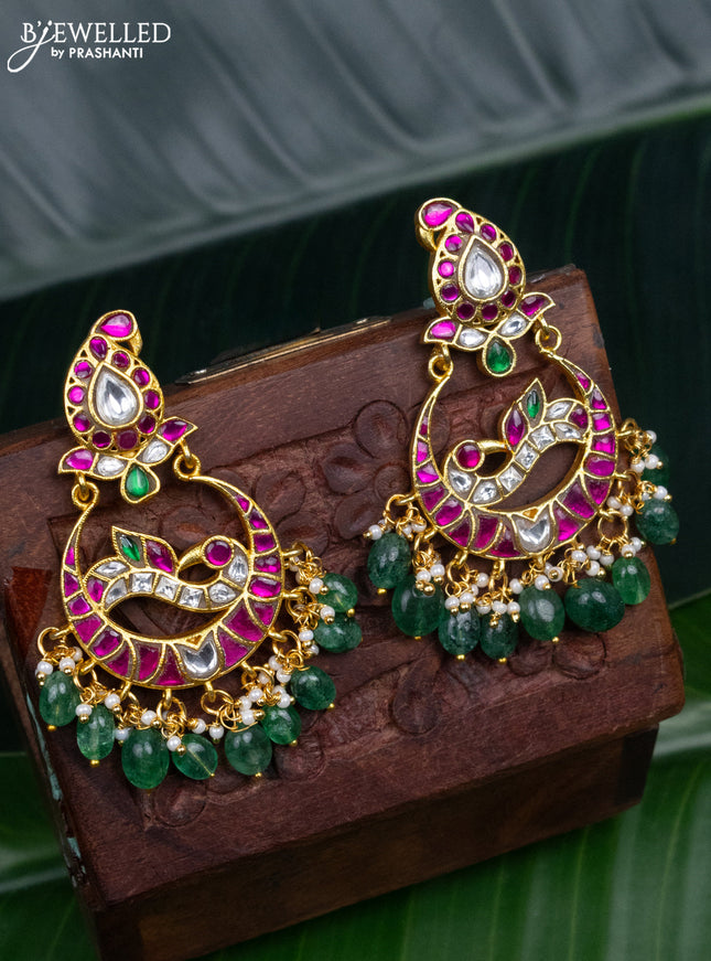 Jadau earrings peacock design with jadau kundan stones and pearl & green beads hanging