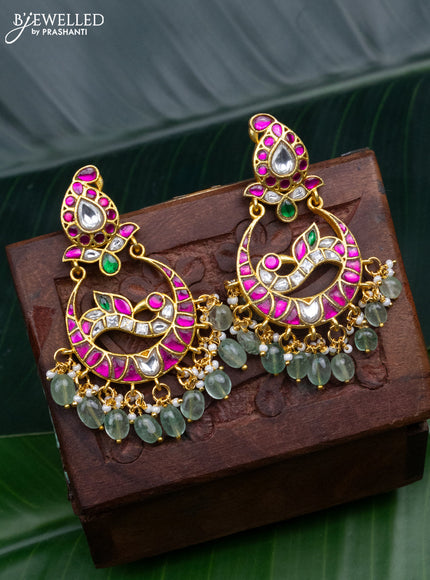 Jadau earrings peacock design with jadau kundan stones and pearl & mint green beads hanging
