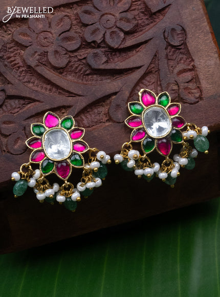Jadau screw type earrings with jadau kundan stones and pearl & mint green beads hanging