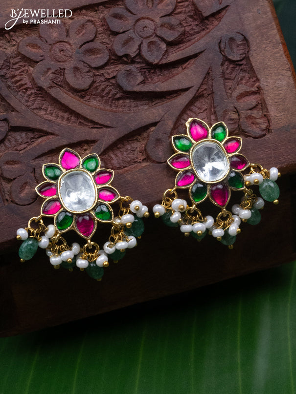 Jadau screw type earrings with jadau kundan stones and pearl & mint green beads hanging