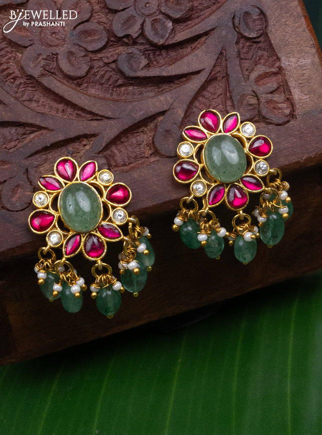Jadau screw type earrings with jadau kundan stones and pearl & mint green beads hanging