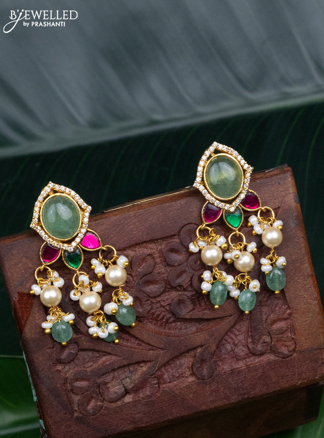Jadau screw type earrings with jadau kundan stones and pearl & mint green beads hanging