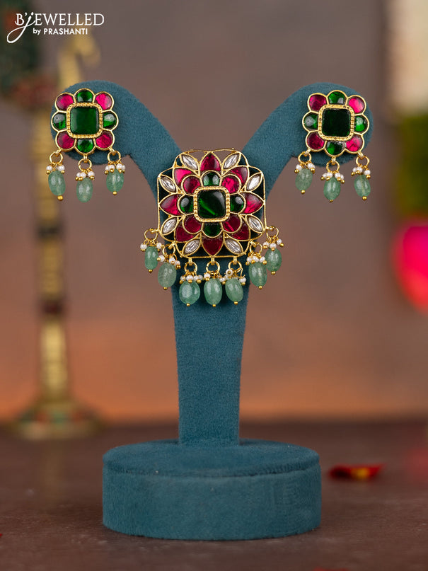Jadau pendant set floral design with jadau kundan stones and pearl & green beads hanging