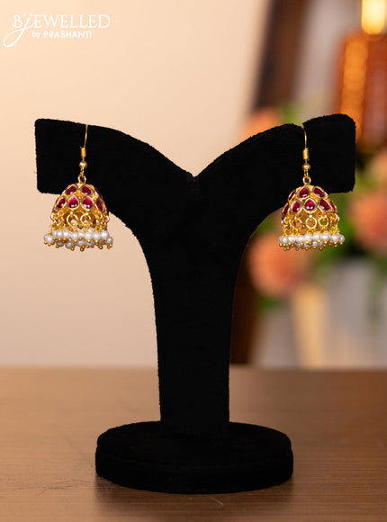 Jadau hanging type jhumkas with pink jadau stones and pearl hangings