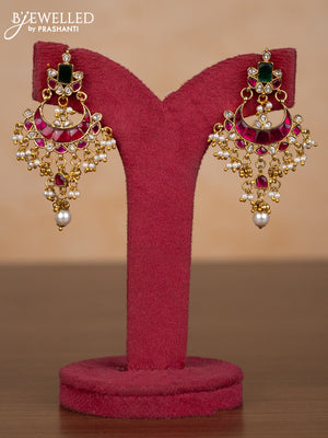 Jadau earrings with kemp jadau kundan stones and pearl hangings