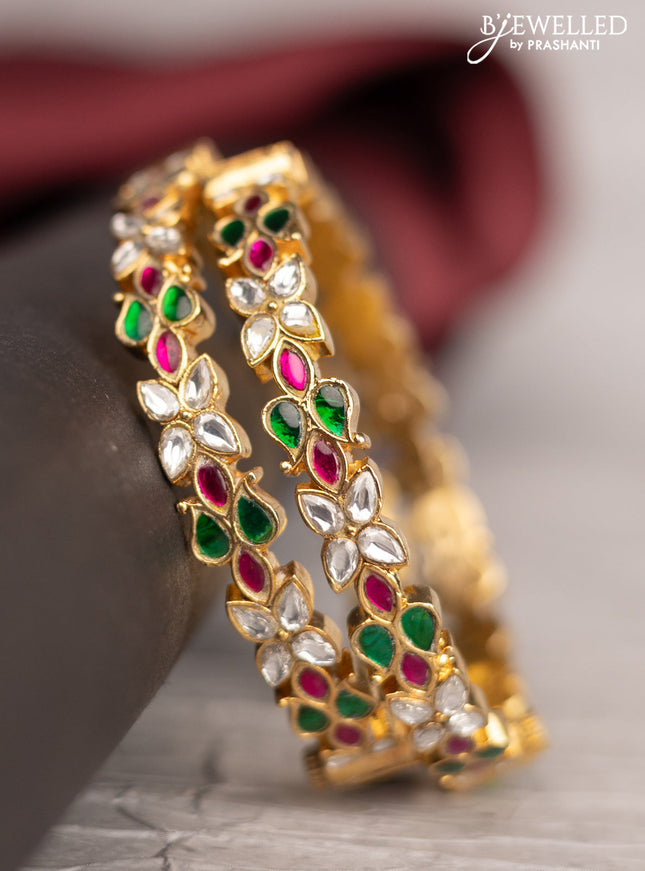 Antique screw type bangle with floral design and jadau & kundan stones