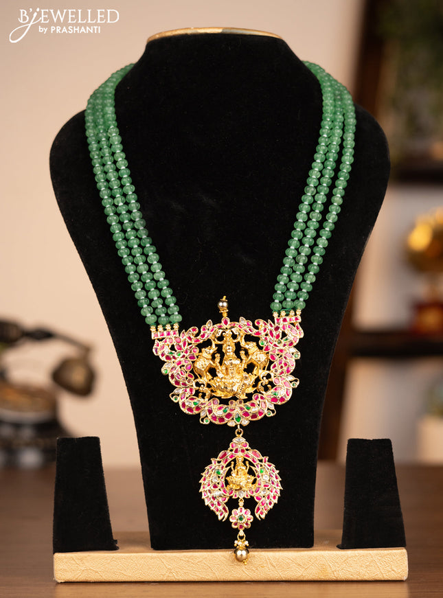 Antique beaded green necklace lakshmi pendant with jadau kundan stones and golden beads hanging without earrings