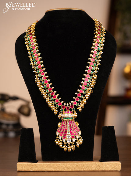Antique necklace with jadau kundan stones and pearl & golden beads hanging without earrings