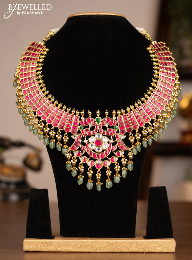 Antique necklace with jadau kundan stones and green beads & golden beads hanging without earrings