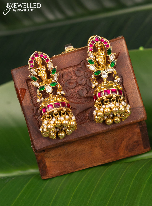 Antique screw type jhumka krishna design with jadau kundan stones and pearl & golden beads hanging