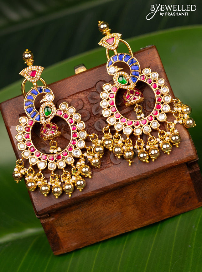 Antique screw type earrings peacock design with jadau kundan stones and pearl & golden beads hanging