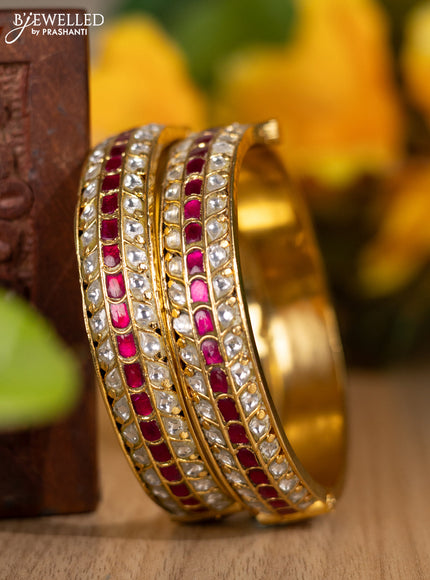 Jadau screw type bangles with kundan and pink jadau stones