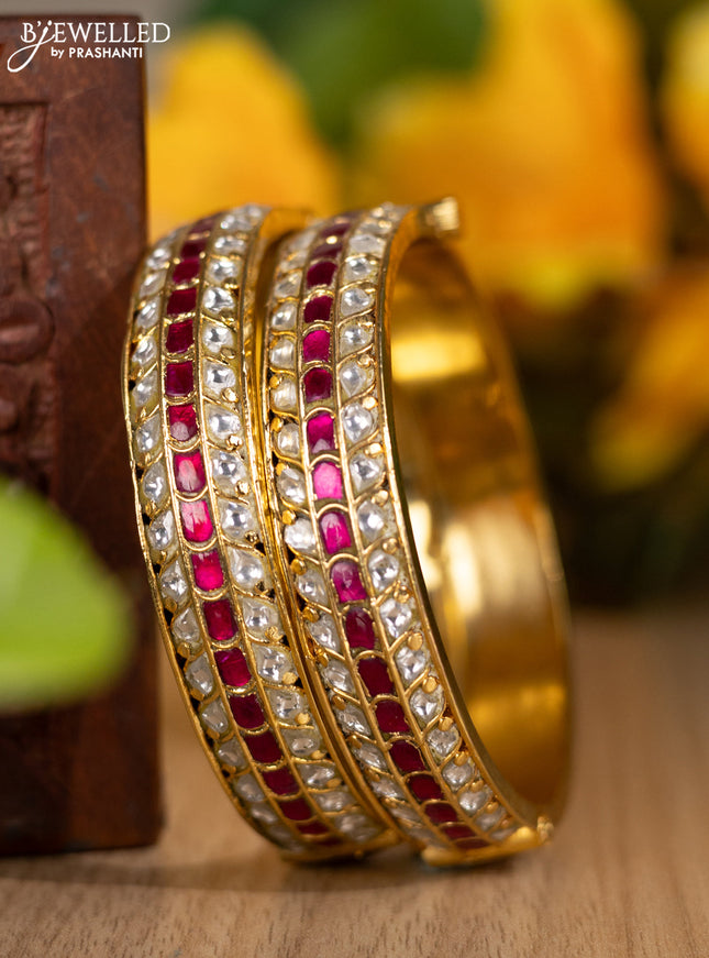 Jadau screw type bangles with kundan and pink jadau stones