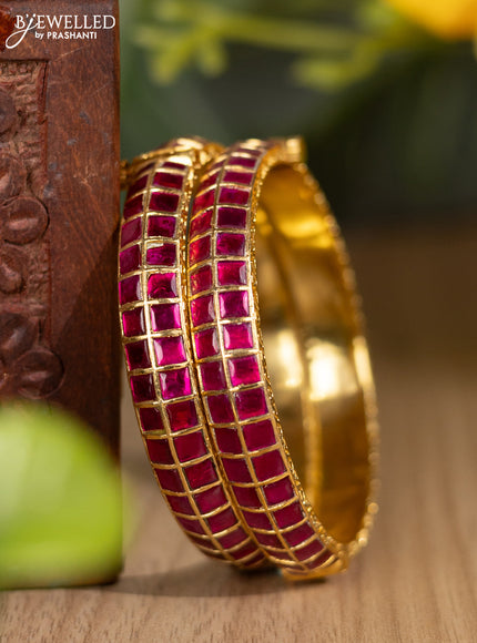 Jadau screw type bangles with pink jadau stones