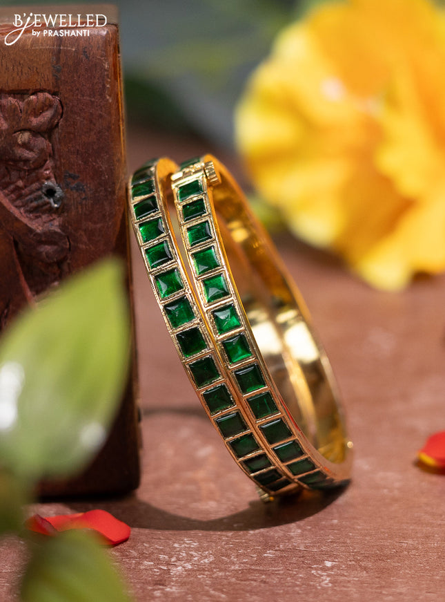 Jadau screw type bangle with green jadau stones