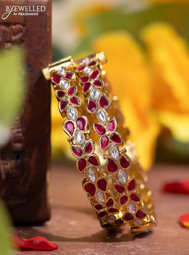 Jadau screw type bangle with floral design and pink jadau & kundan stones