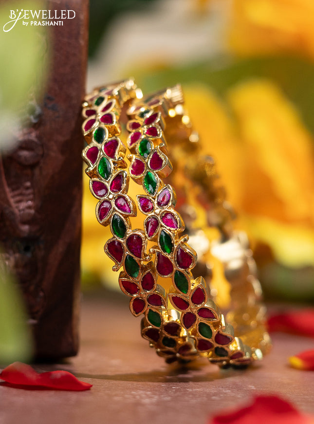 Jadau screw type bangle with floral design and jadau kemp stones