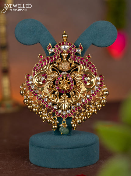 Jadau pendant lakshmi & peacock design with jadau kundan stones and pearl & golden beads hanging