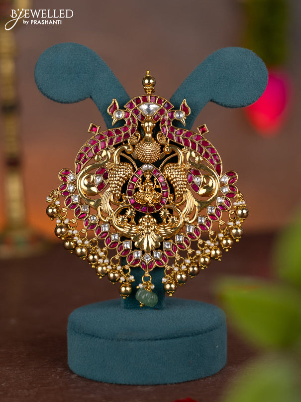 Jadau pendant lakshmi & peacock design with jadau kundan stones and pearl & golden beads hanging