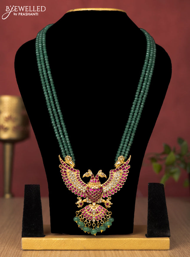 Jadau beaded green haaram garuda pendant with jadau kundan stones and pearl & natural beads hanging without earrings
