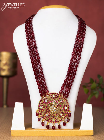 Jadau beaded maroon haaram peacock and floral pendant with jadau pink & kundan stones and pearl & beads hanging without earrings